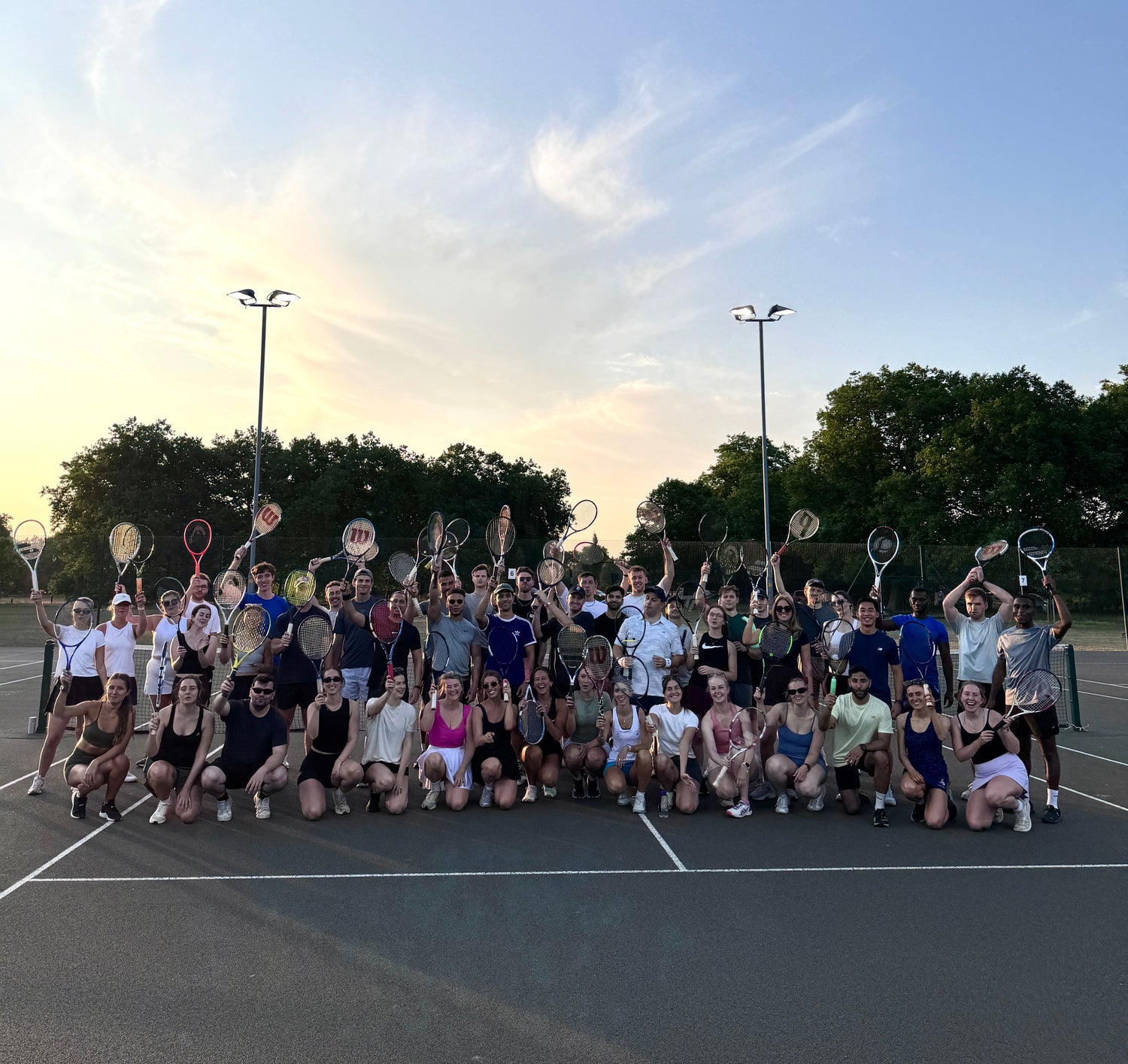 Group of people playing social tennis at Net Socials, a social tennis club and community in London